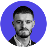 Black and white portrait of a man with dark hair and beard against a blue circle.