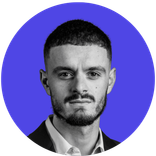 Young man with short dark hair and beard in grayscale against a blue circle.