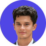 Young man with dark curly hair smiling against a solid blue background.